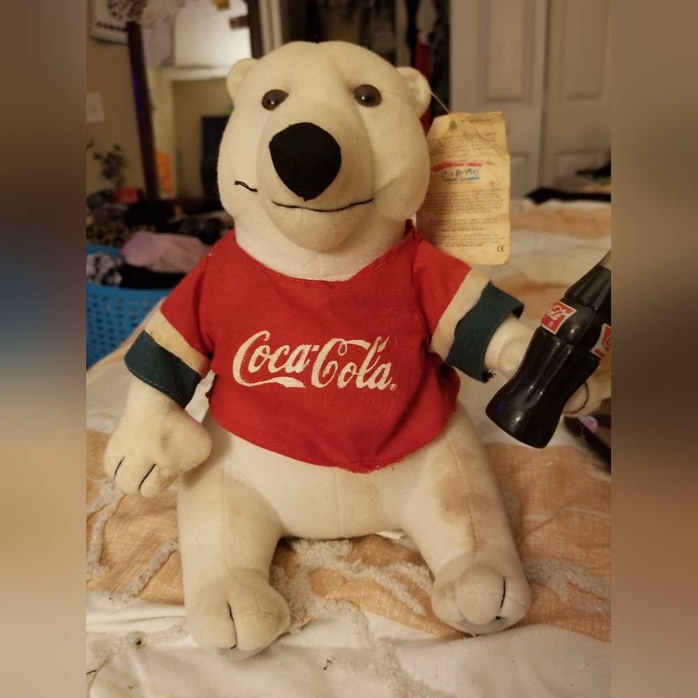 An antique Coca-Cola stuffed bear
